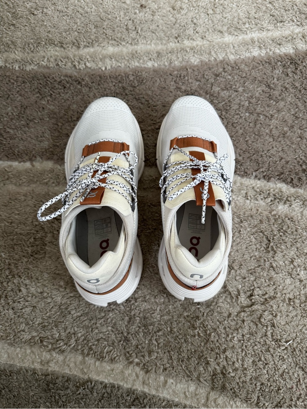 On Running Women's White Sneakers with Tan Accents and Black‑Patterned Laces